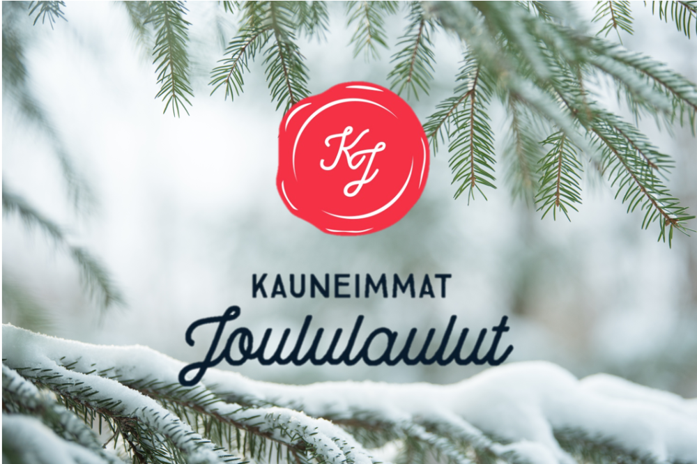 Lumisia kuusen oksia, joiden päällä KJ-sinetti eli Kauneimmat joululaulut logo